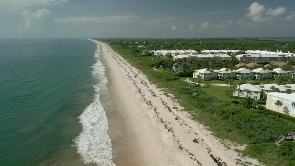 Aerial view of the Vero Beach shoreline with oceanfront condominiums and landscaped grounds